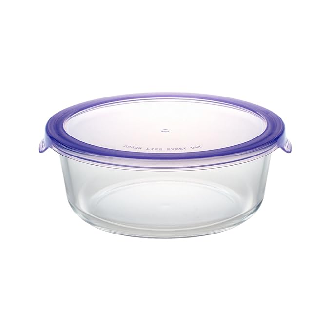 Clear glass food container with a purple lid on a white background